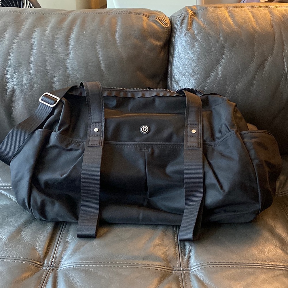 Barely used black Lululemon Duffle w/yoga mat holder